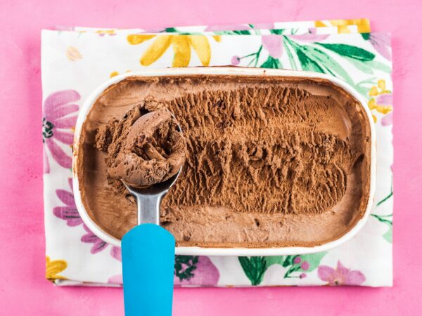 Ice cream scoop in chocolate ice cream tub